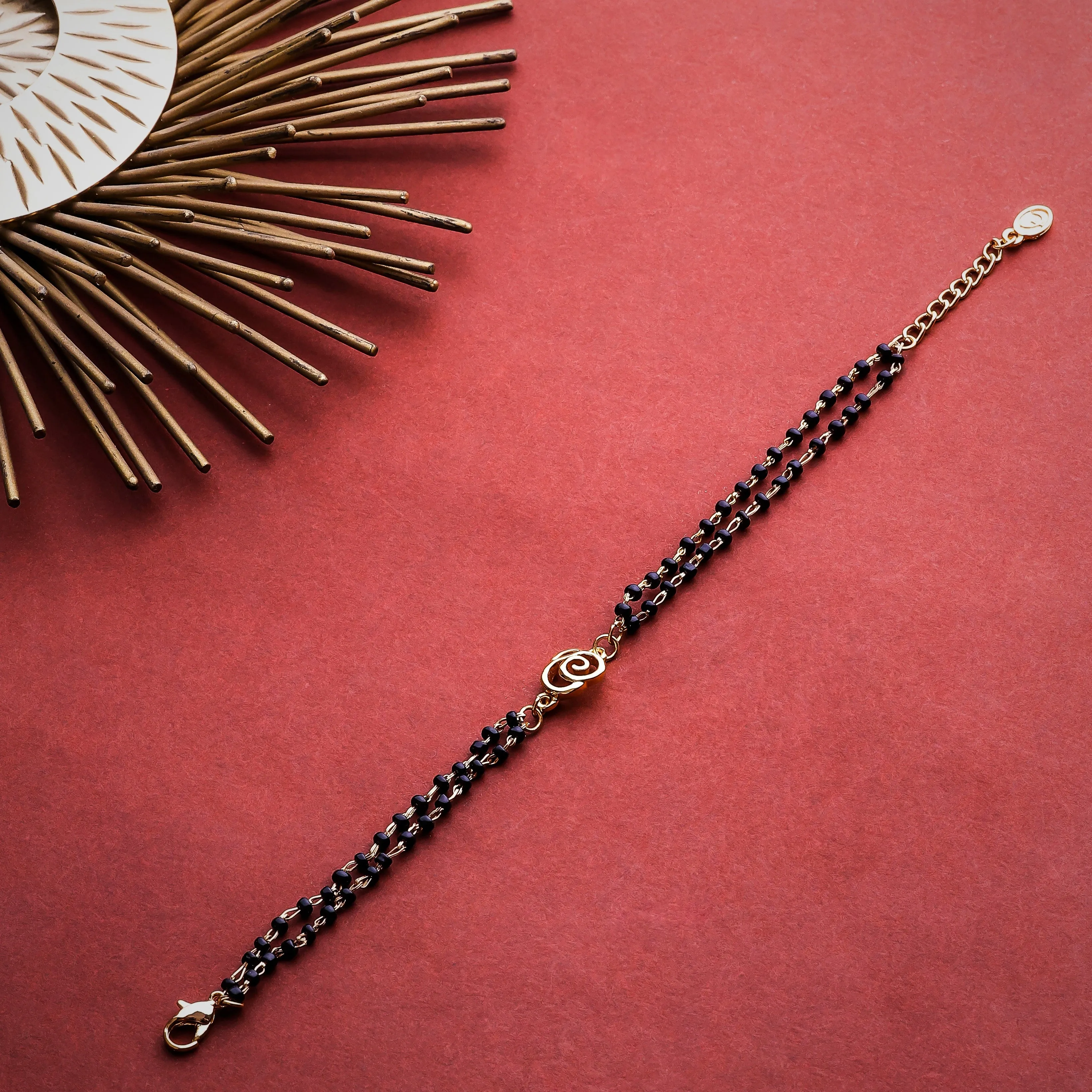 Estele Gold Plated Floral Shaped Bracelet with Black Beads for Women