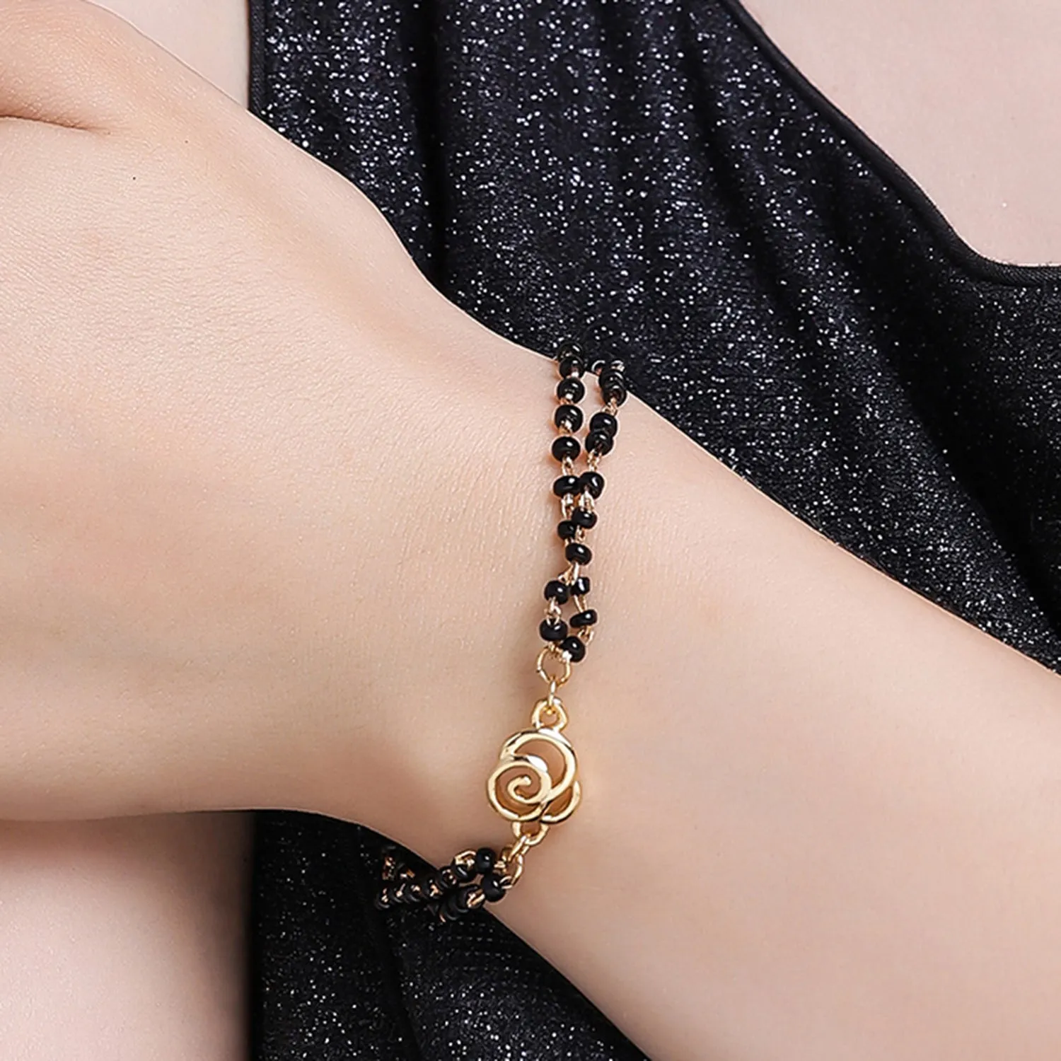 Estele Gold Plated Floral Shaped Bracelet with Black Beads for Women