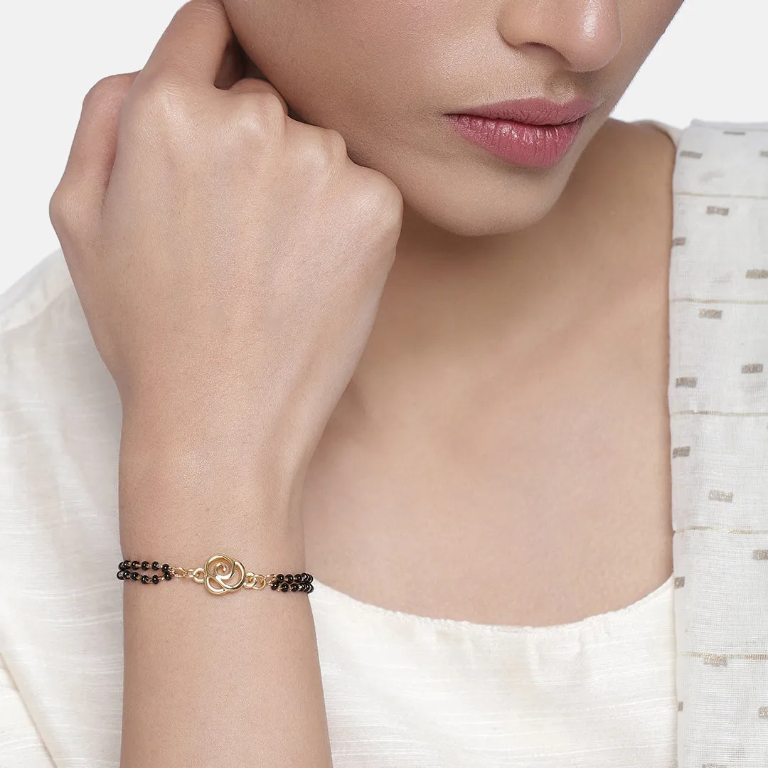 Estele Gold Plated Floral Shaped Bracelet with Black Beads for Women
