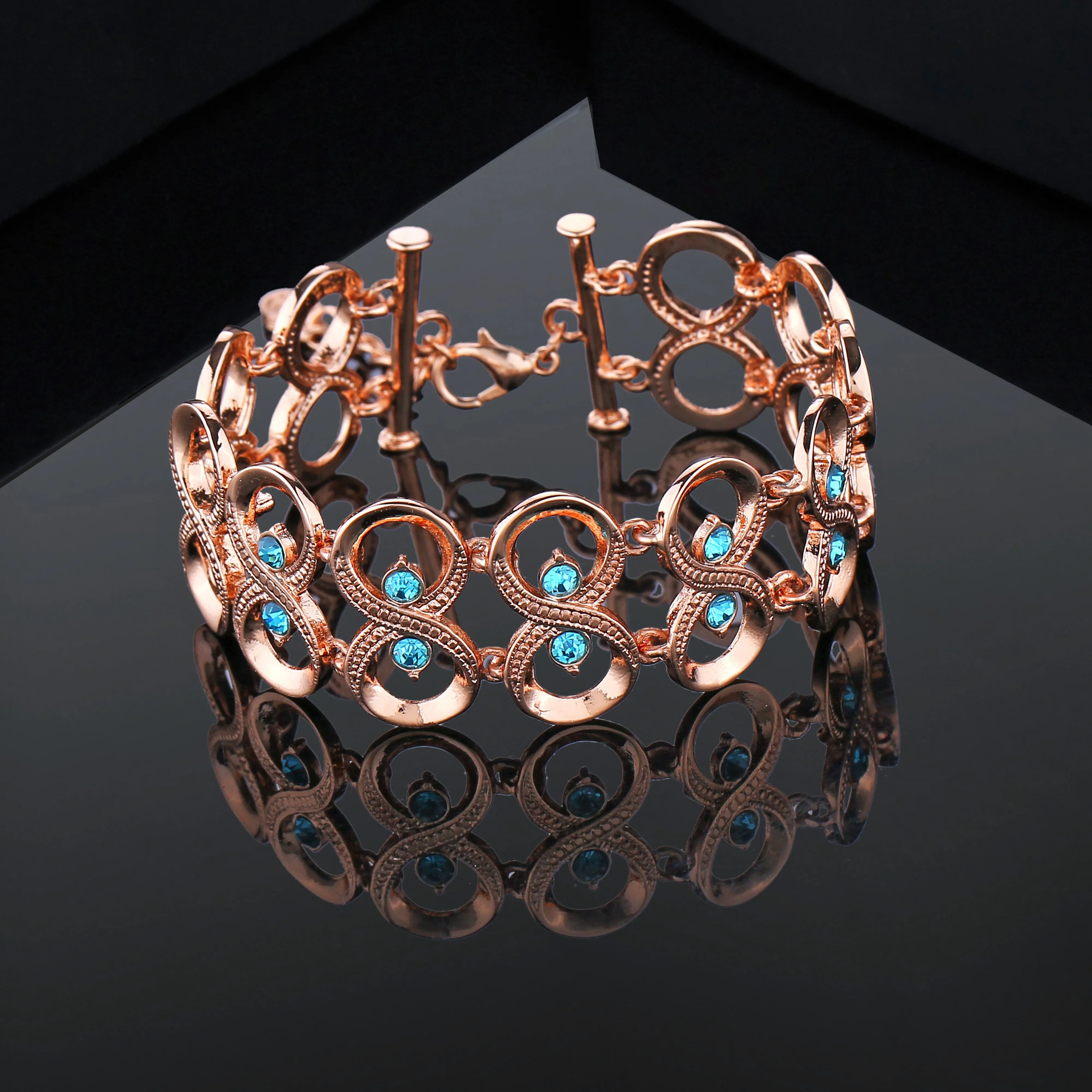 Estele Rose Gold Plated Sparkling Infinity Designer Bracelet with Blue Austrian Crystals for Women