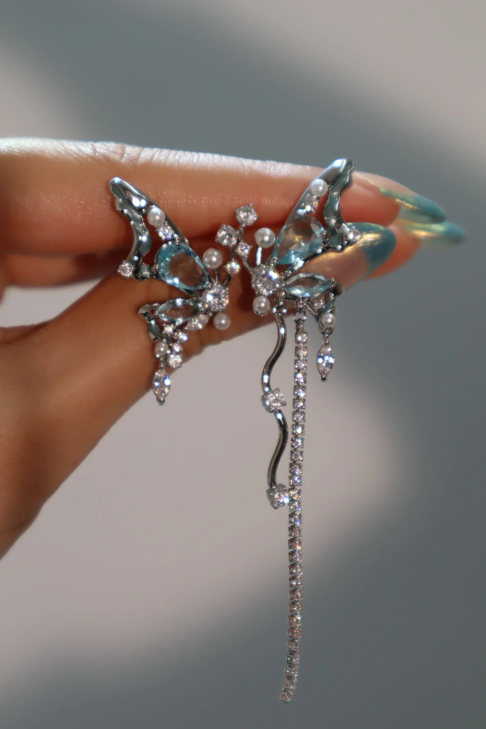Platinum Plated Blue Gem Butterfly Earrings