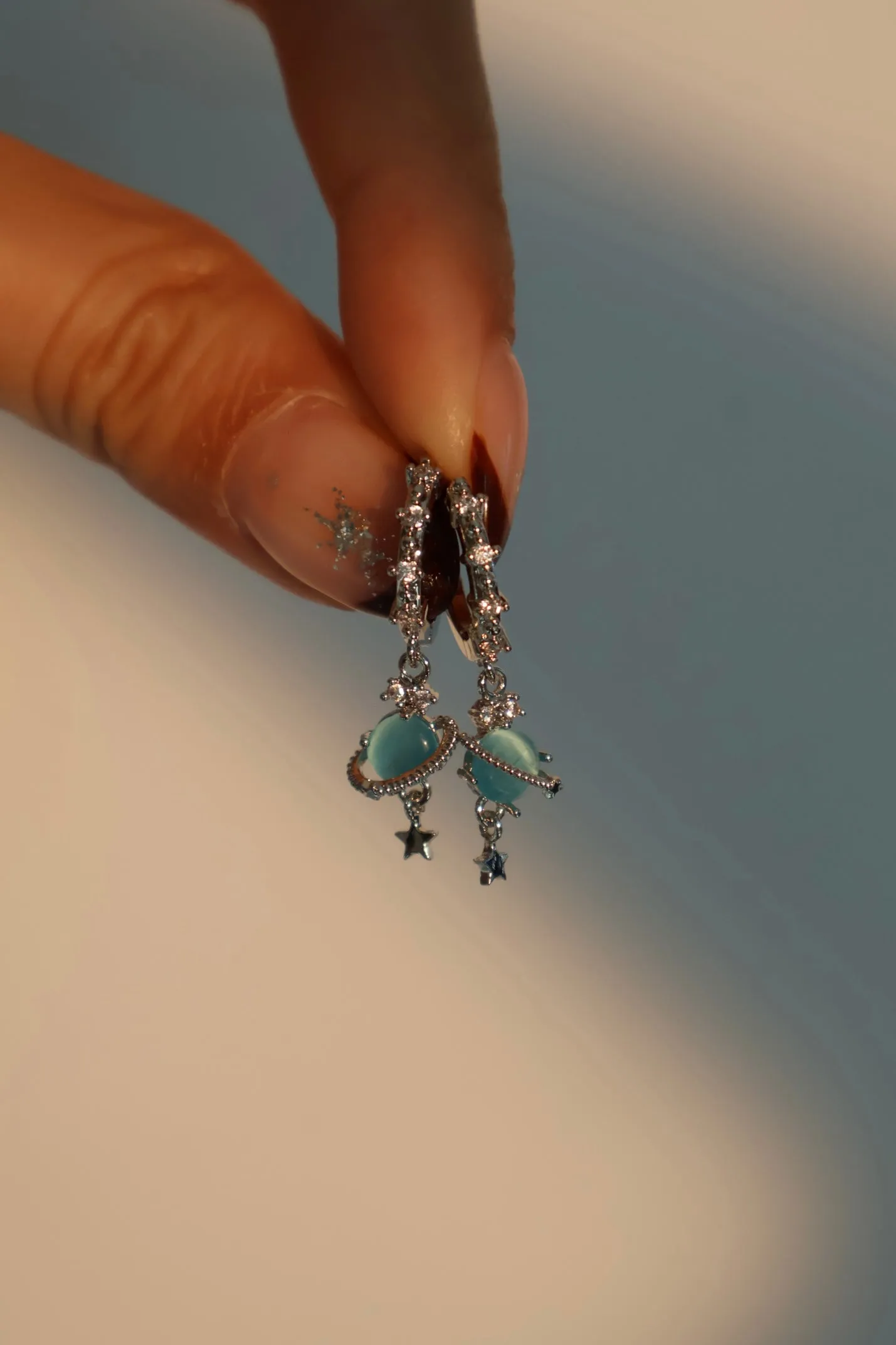 Platinum Plated Saturn Star Hoop Earrings