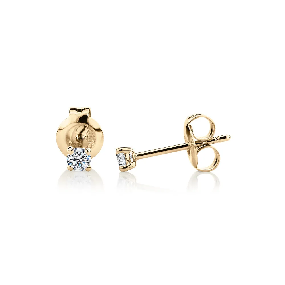 Round Brilliant stud earrings with 0.15 carats* of diamond simulants in 10 carat yellow gold