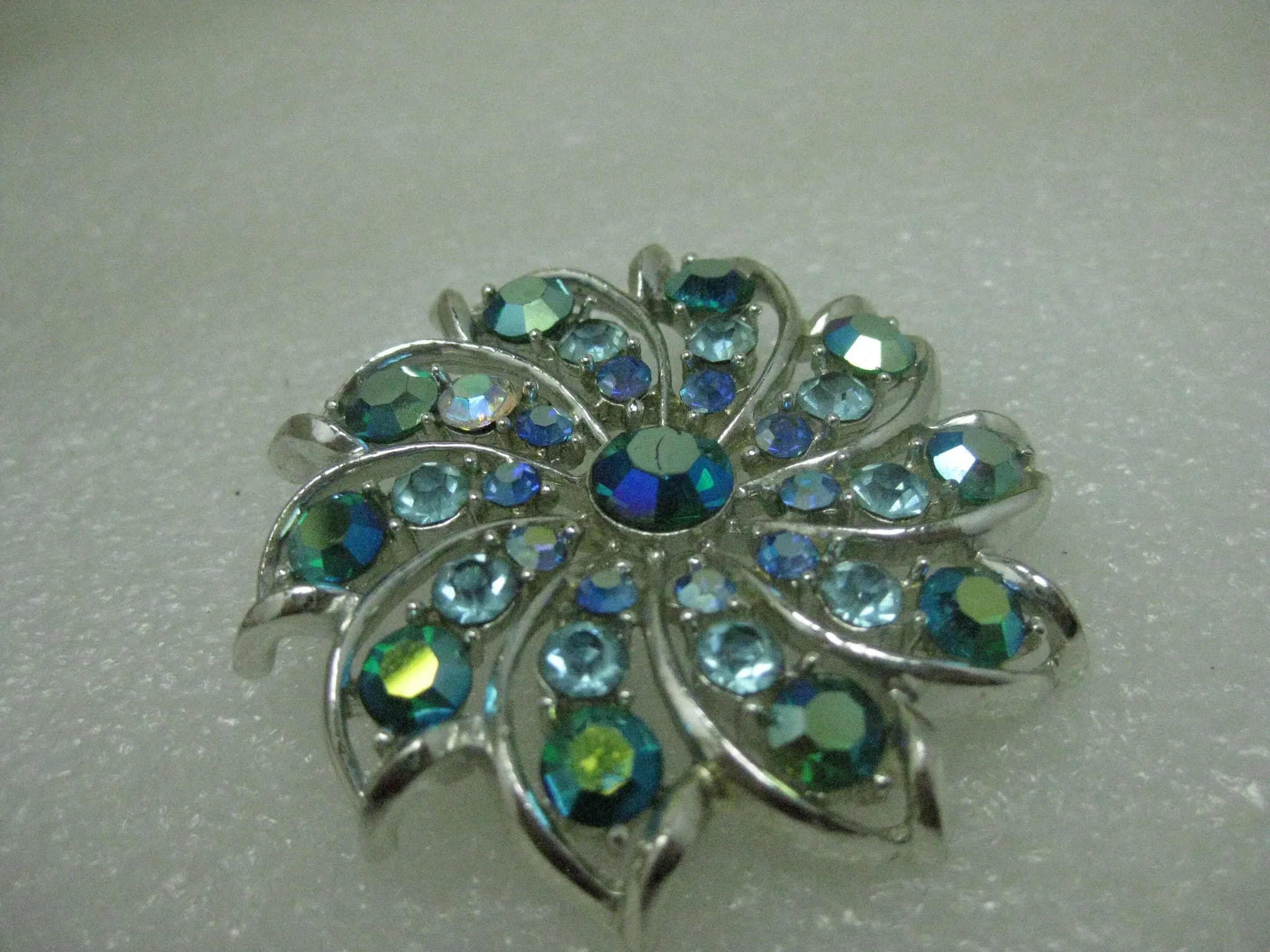 Vintage Silver Tone Spiral Rhinestone Brooch, Shades of Blue & Teal, 2", Mid-Century